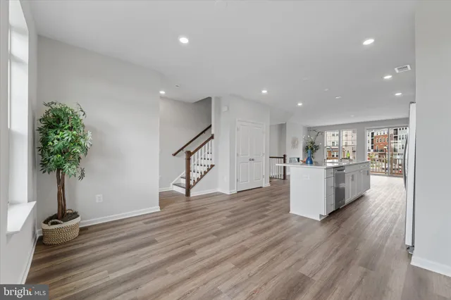 a view of kitchen with furniture and wooden floor