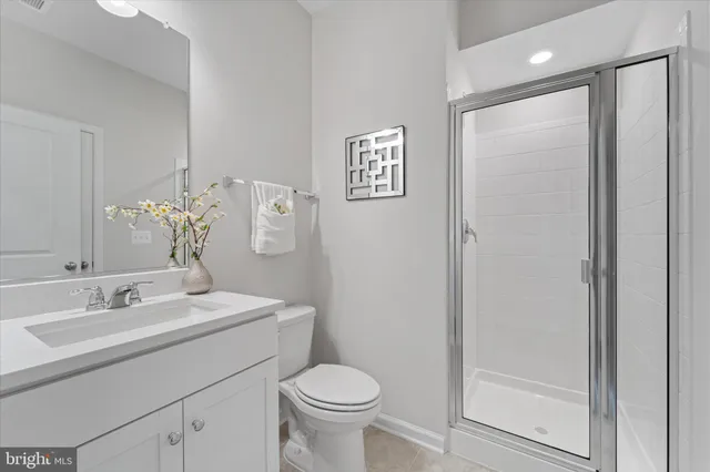 a bathroom with a toilet sink and shower