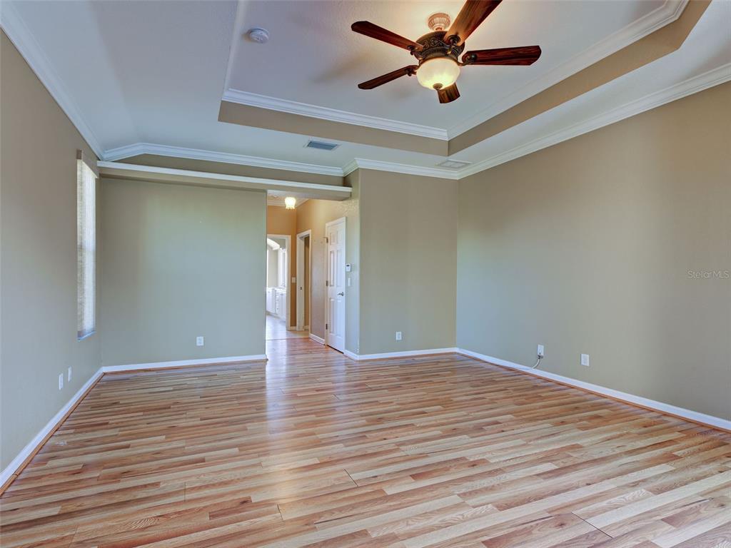 45 Tee View Road Rotonda West, FL 33947 - Photo 15 of 64 a view of an empty room and wooden floor