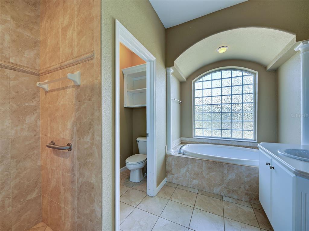 45 Tee View Road Rotonda West, FL 33947 - Photo 19 of 64 a bathroom with a toilet and a shower