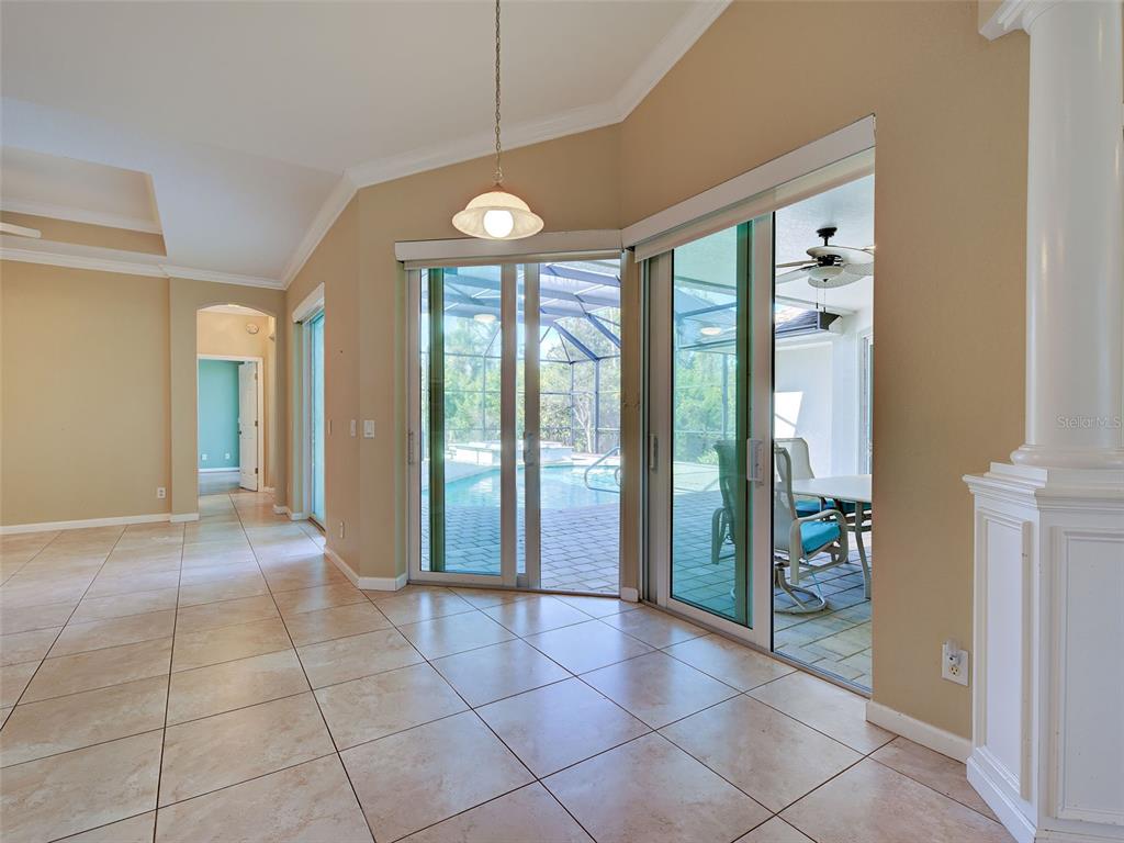 45 Tee View Road Rotonda West, FL 33947 - Photo 25 of 64 a view of an entryway with a chandelier
