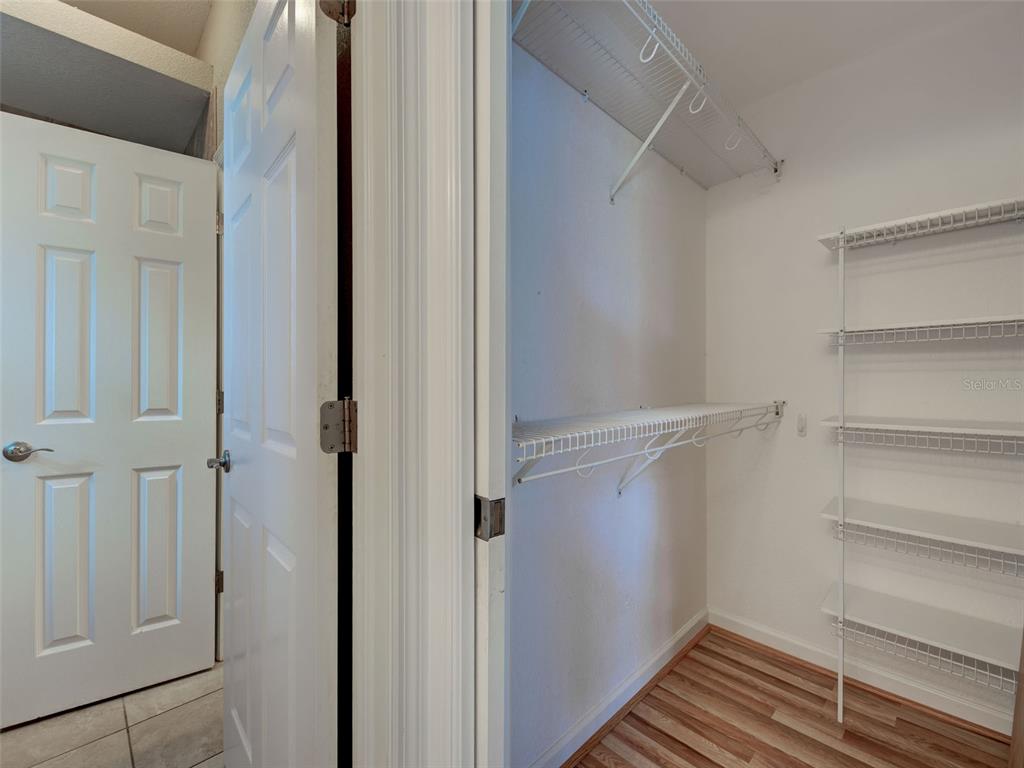 45 Tee View Road Rotonda West, FL 33947 - Photo 37 of 64 a view of walk in closet with empty racks