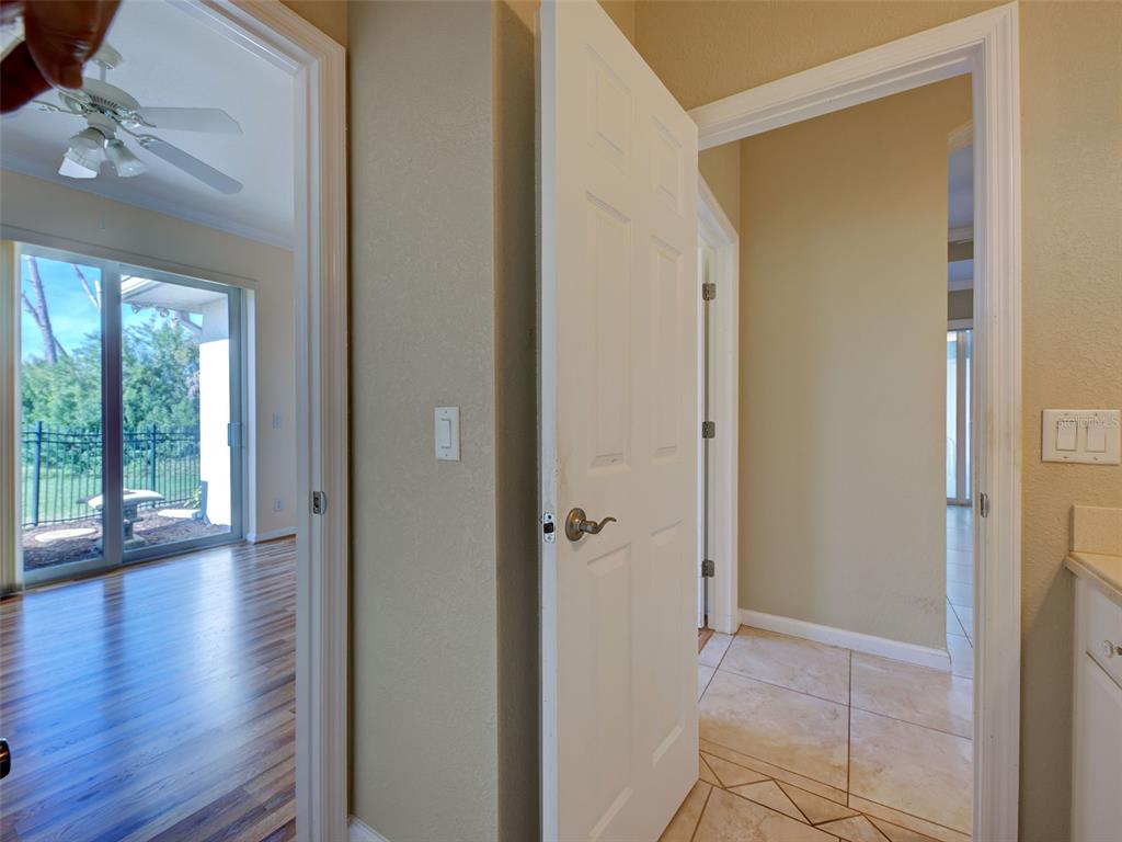 45 Tee View Road Rotonda West, FL 33947 - Photo 40 of 64 an empty room with wooden floor and a window