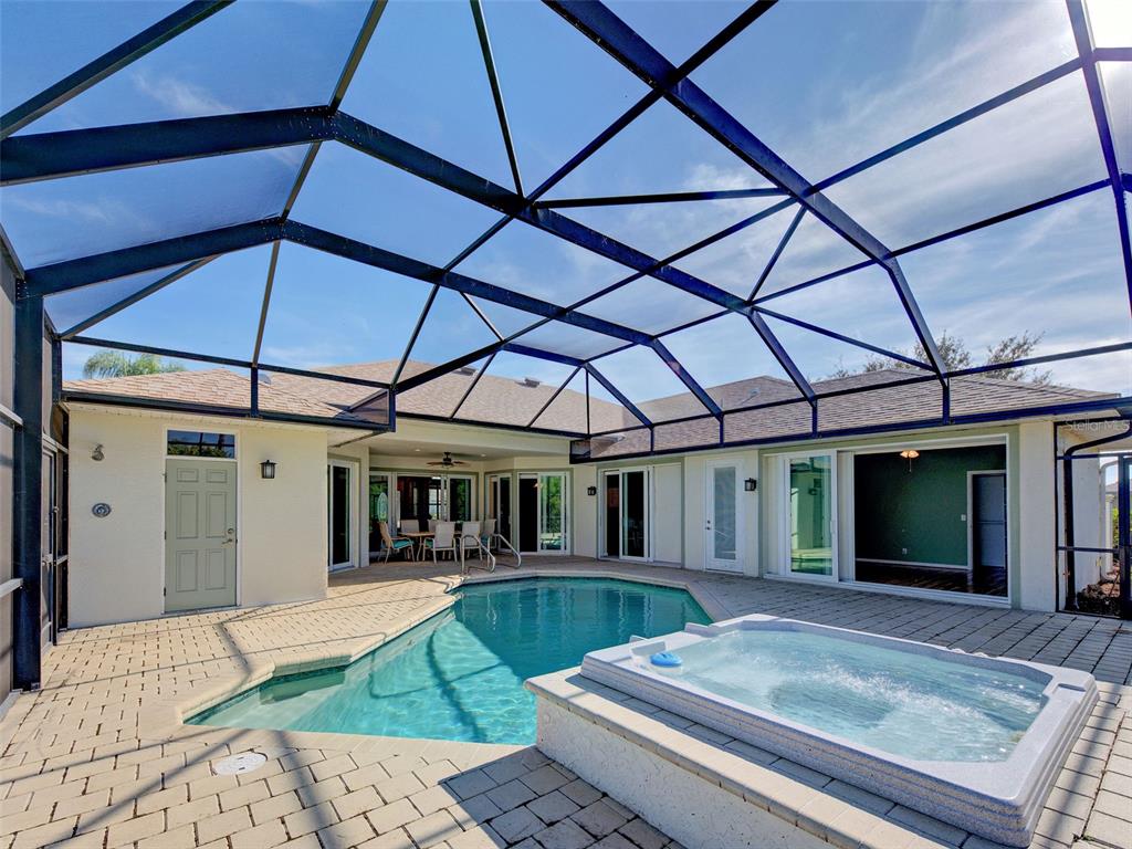 45 Tee View Road Rotonda West, FL 33947 - Photo 4 of 64 a view of a backyard with a small cabin