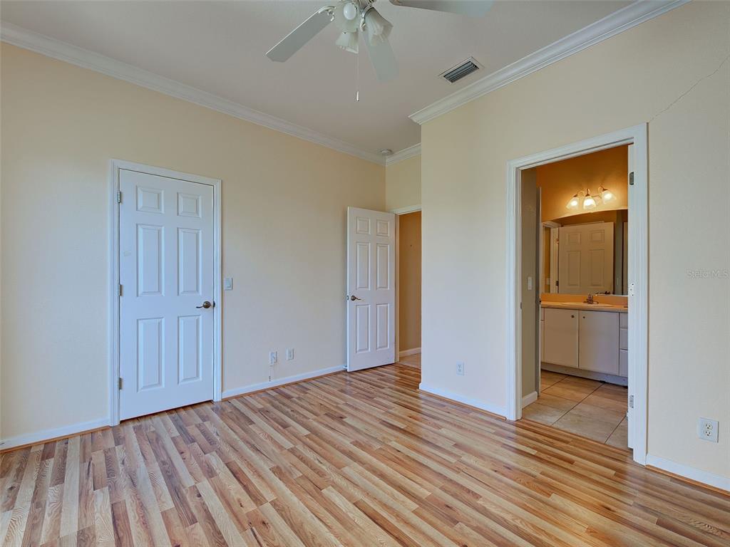 45 Tee View Road Rotonda West, FL 33947 - Photo 42 of 64 a view of a room with wooden floor and a bathroom