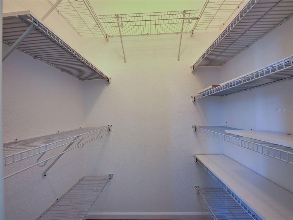 45 Tee View Road Rotonda West, FL 33947 - Photo 44 of 64 a view of a room with racks on the wall