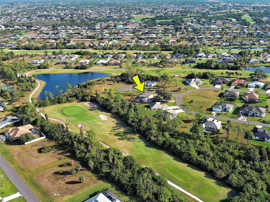 45 Tee View Road Rotonda West, FL 33947 - Photo 61 of 64 an aerial view of residential houses with outdoor space