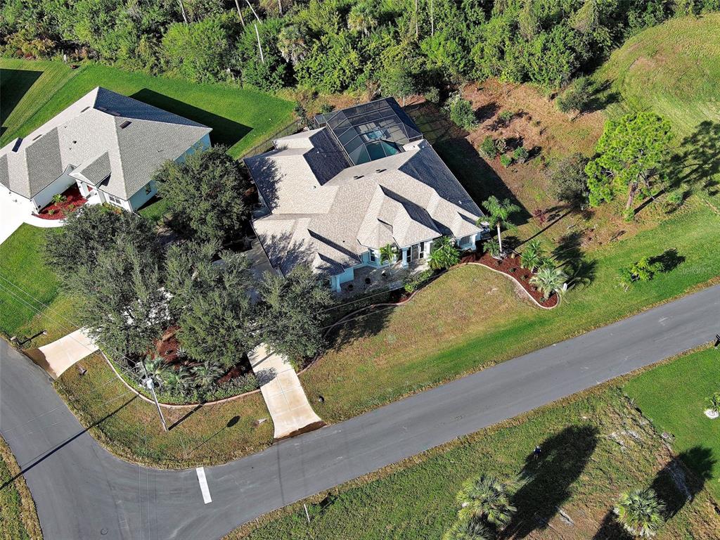 45 Tee View Road Rotonda West, FL 33947 - Photo 62 of 64 an aerial view of a house with garden space and street view