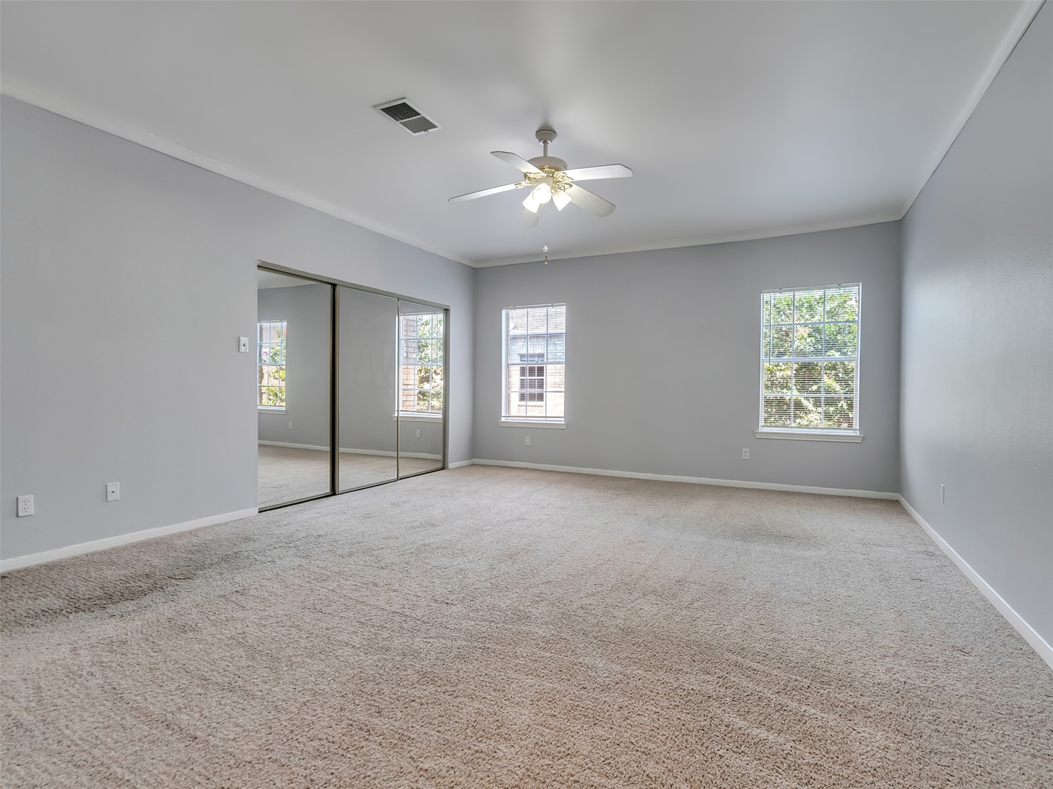 4001 Tanglewilde Street, Unit 605 Houston, TX 77063 - Photo 17 of 29 a view of an empty room with chandelier fan and windows