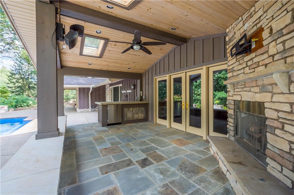145 Rockingham Lane Canonsburg, PA 15317 - Photo 12 of 43 Covered outdoor entertainment area, fireplace and pool