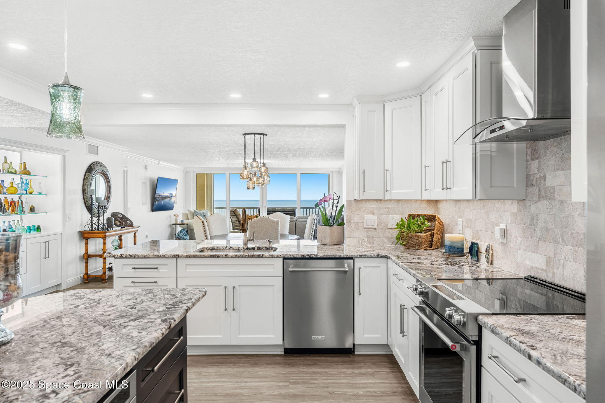 407 Florida A1A, Unit 464 Satellite Beach, FL 32937 - Photo 12 of 38 a kitchen with a sink stove and cabinets