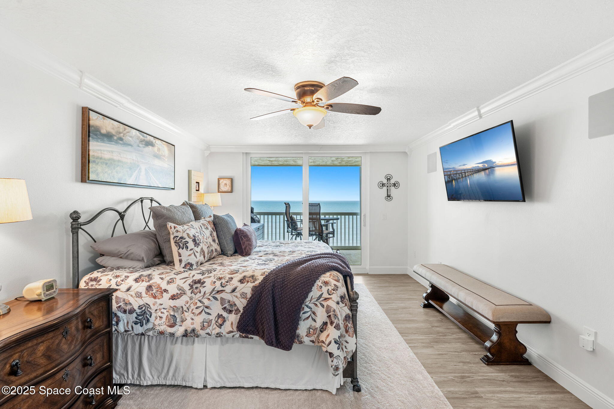 407 Florida A1A, Unit 464 Satellite Beach, FL 32937 - Photo 15 of 38 a bedroom with a bed and a flat screen tv