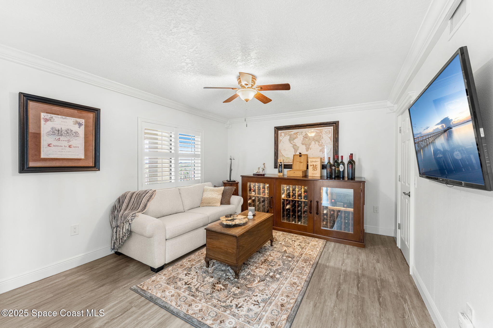 407 Florida A1A, Unit 464 Satellite Beach, FL 32937 - Photo 22 of 38 a living room with furniture and wooden floor