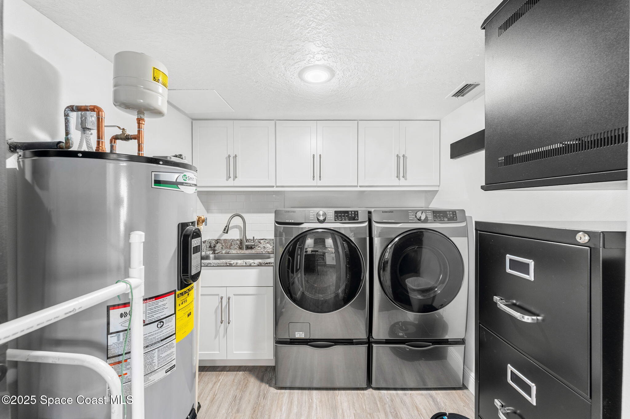 407 Florida A1A, Unit 464 Satellite Beach, FL 32937 - Photo 24 of 38 a utility room with dryer and washer