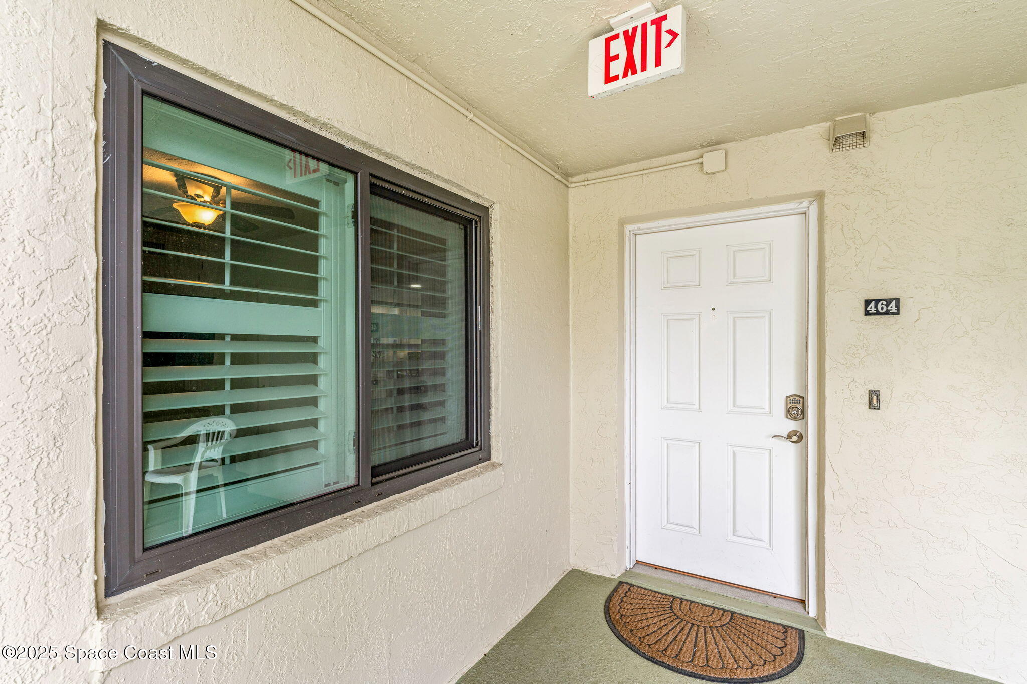 407 Florida A1A, Unit 464 Satellite Beach, FL 32937 - Photo 29 of 38 a view of entryway and kitchen