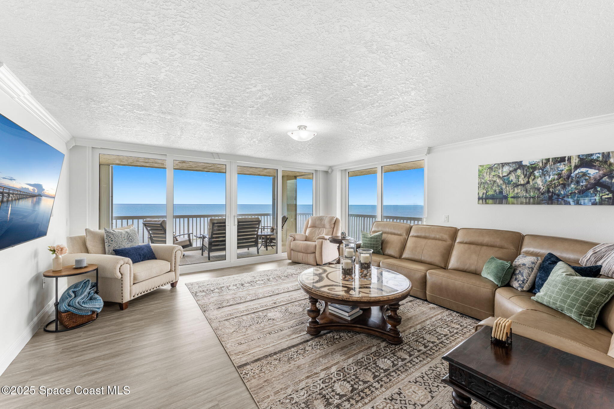 407 Florida A1A, Unit 464 Satellite Beach, FL 32937 - Photo 5 of 38 a living room with furniture and a large window