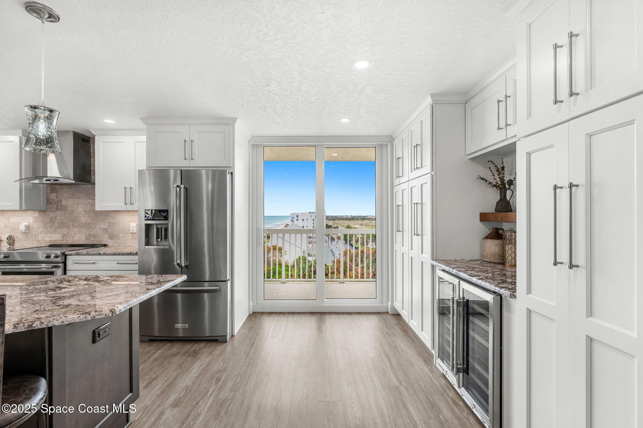 407 Florida A1A, Unit 464 Satellite Beach, FL 32937 - Photo 7 of 38 a kitchen with stainless steel appliances a refrigerator and a stove top oven