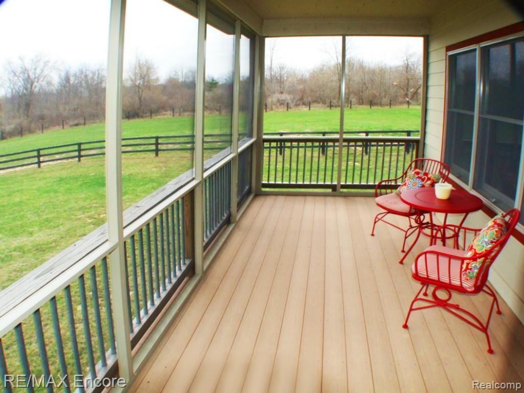 8363 Henderson Road Goodrich, MI 48438 - Photo 8 of 44 Large screened-in porch overlooking pastures
