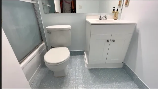 a white toilet sitting next to a sink