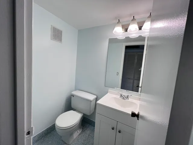 a bathroom with a sink and mirror