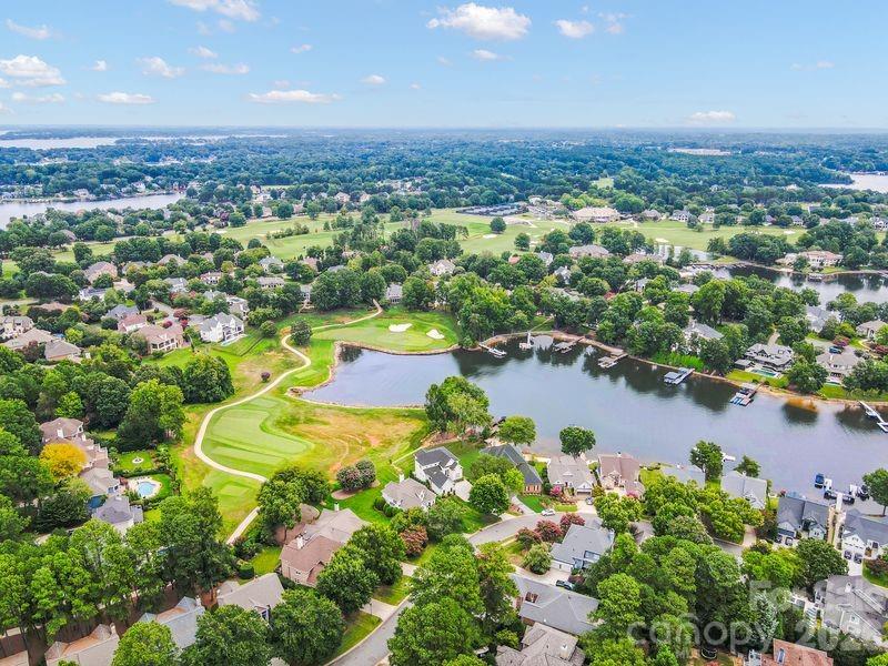 17426 Springwinds Drive, Unit 122 Cornelius, NC 28031 - Photo 13 of 36 an aerial view of residential houses with outdoor space and lake view