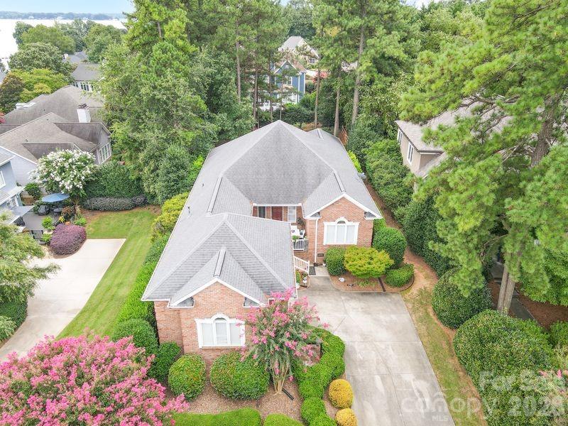 17426 Springwinds Drive, Unit 122 Cornelius, NC 28031 - Photo 16 of 36 a view of a garden with a house