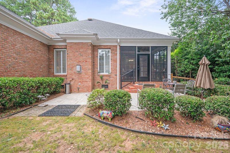 17426 Springwinds Drive, Unit 122 Cornelius, NC 28031 - Photo 25 of 36 a front view of a house with garden