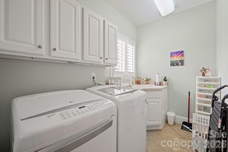 17426 Springwinds Drive, Unit 122 Cornelius, NC 28031 - Photo 26 of 36 a utility room with dryer and washer