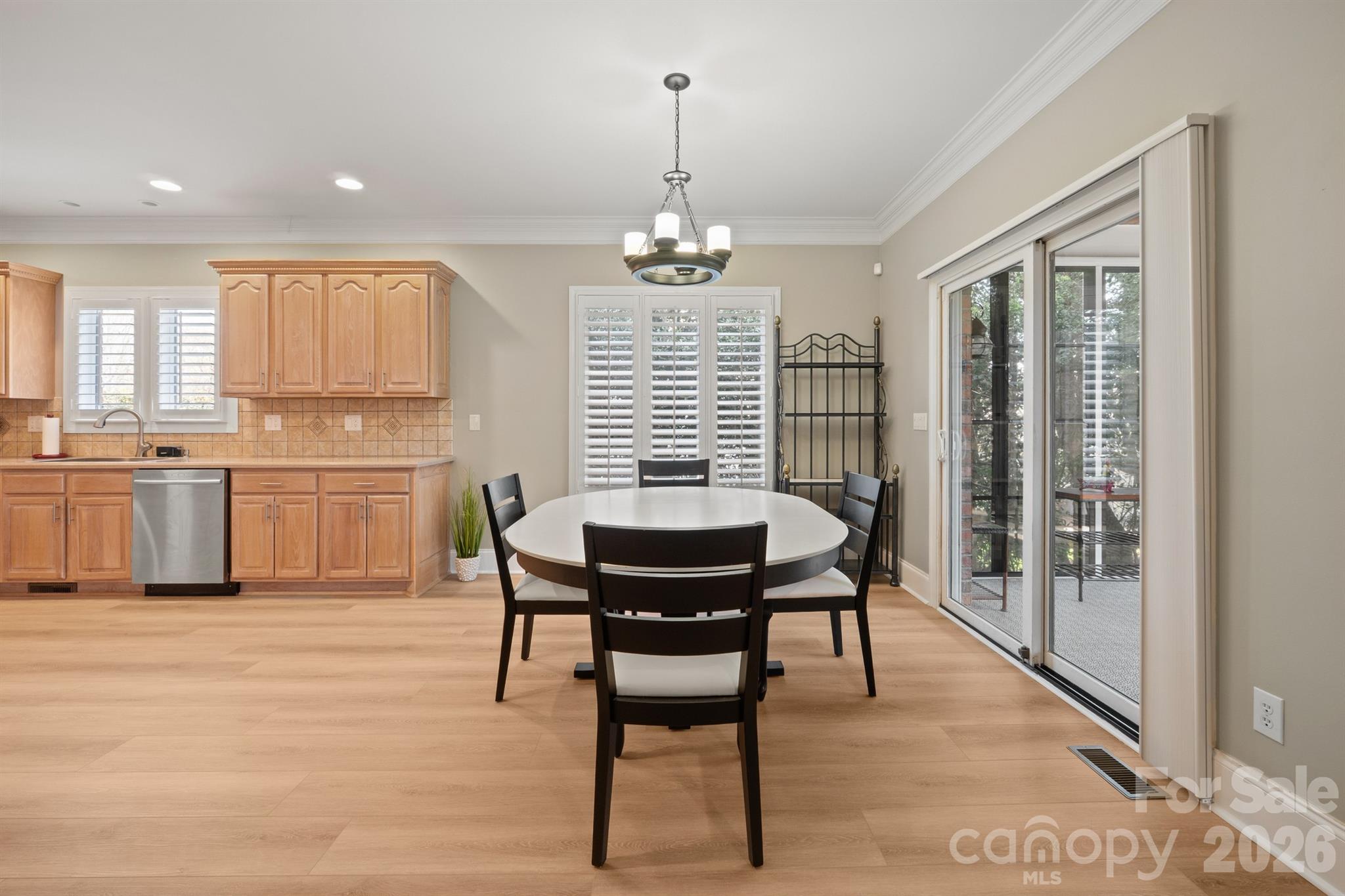 17426 Springwinds Drive, Unit 122 Cornelius, NC 28031 - Photo 33 of 36 a view of a dining room with furniture window and outside view