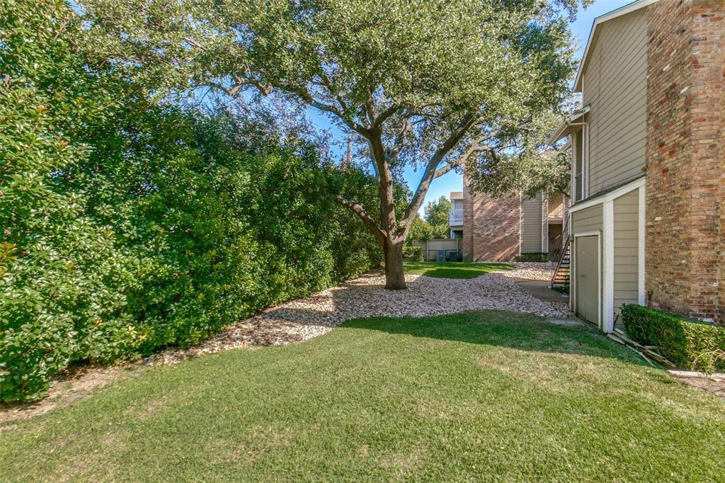 8600 Coppertowne Lane, Unit 1507 Dallas, TX 75243 - Photo 11 of 20 a view of a yard with plants and large trees