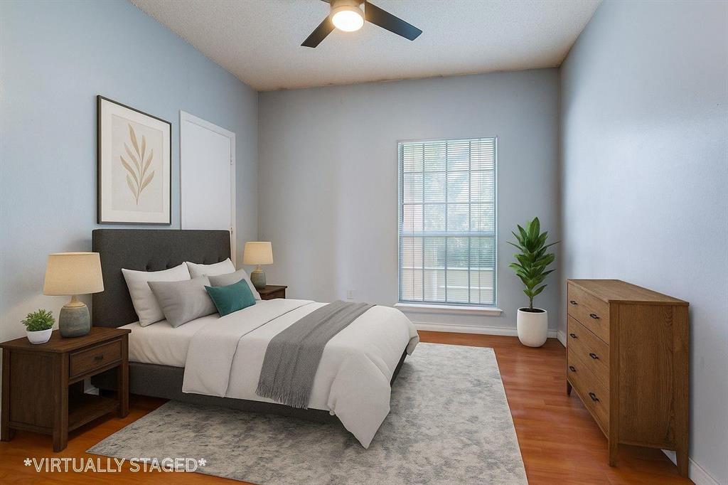 8600 Coppertowne Lane, Unit 1507 Dallas, TX 75243 - Photo 15 of 20 a bedroom with a bed and a potted plant