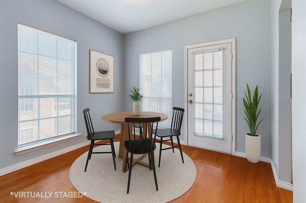 8600 Coppertowne Lane, Unit 1507 Dallas, TX 75243 - Photo 9 of 20 a view of a dining room with furniture and wooden floor