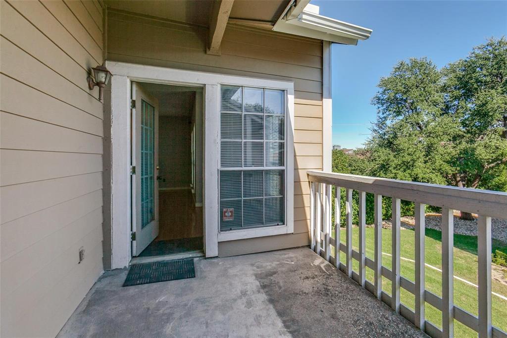 8600 Coppertowne Lane, Unit 1507 Dallas, TX 75243 - Photo 10 of 20 a view of a porch with a table and chairs