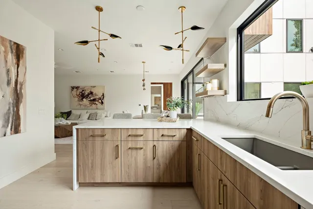 a kitchen with a sink and cabinets