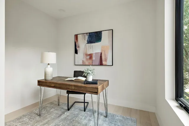 a workspace with furniture and window