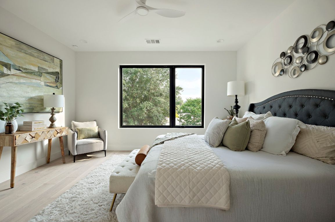 1805 Frazier Avenue Austin, TX 78704 - Photo 24 of 35 a bedroom with a large bed and a large window