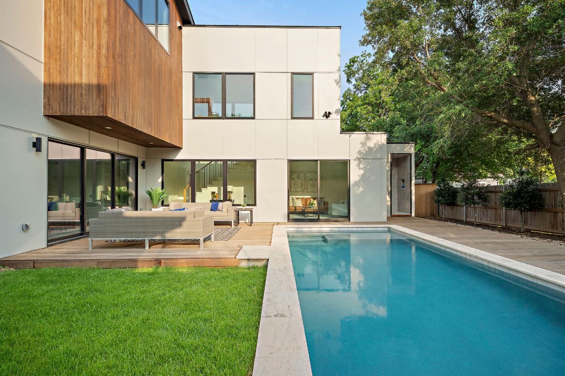 1805 Frazier Avenue Austin, TX 78704 - Photo 28 of 35 a view of a swimming pool with table and chairs under an umbrella