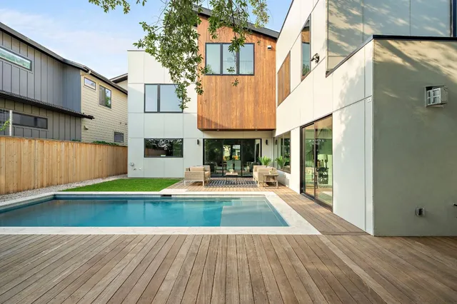 a view of a small pool with seating area