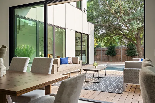 a outdoor living space with furniture and large window