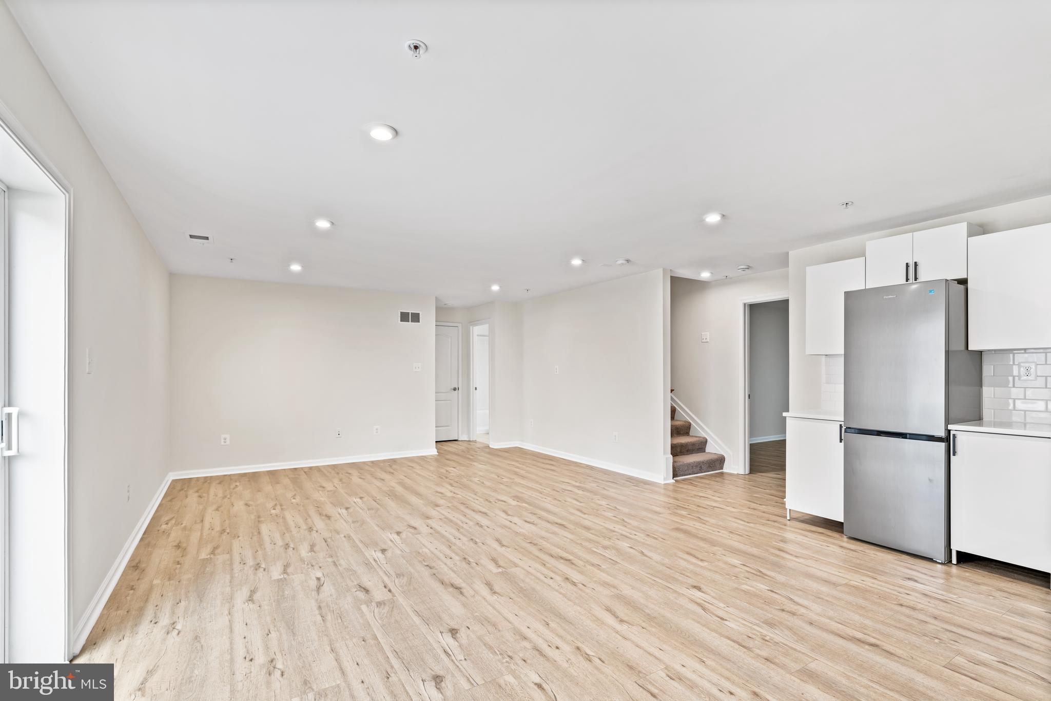 2395 Terrapin Crossing Jessup, MD 20794 - Photo 2 of 11 a view of a kitchen with a sink and a refrigerator