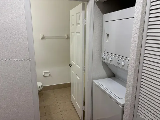 a view of bathroom with a washer and dryer