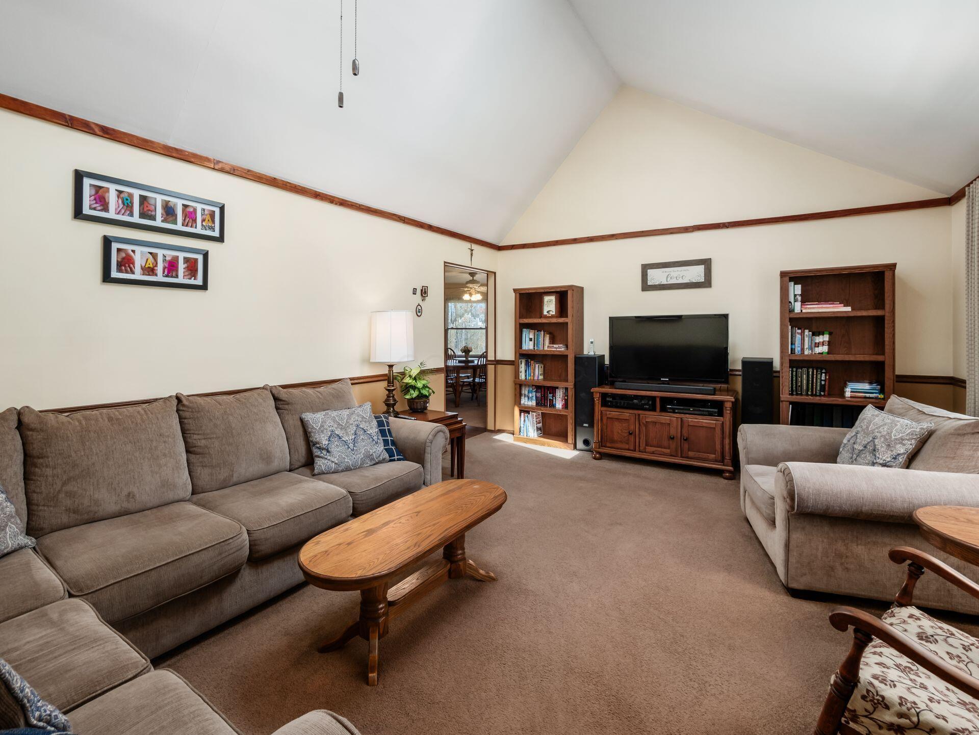 12741 Goodman Road Ashville, OH 43103 - Photo 8 of 61 The inviting living room has cathedral ceilings plus tons of natural light