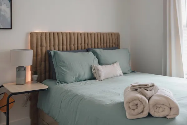 a bedroom with a bed and window