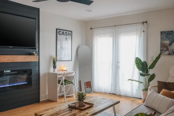 a living room with furniture and a flat screen tv