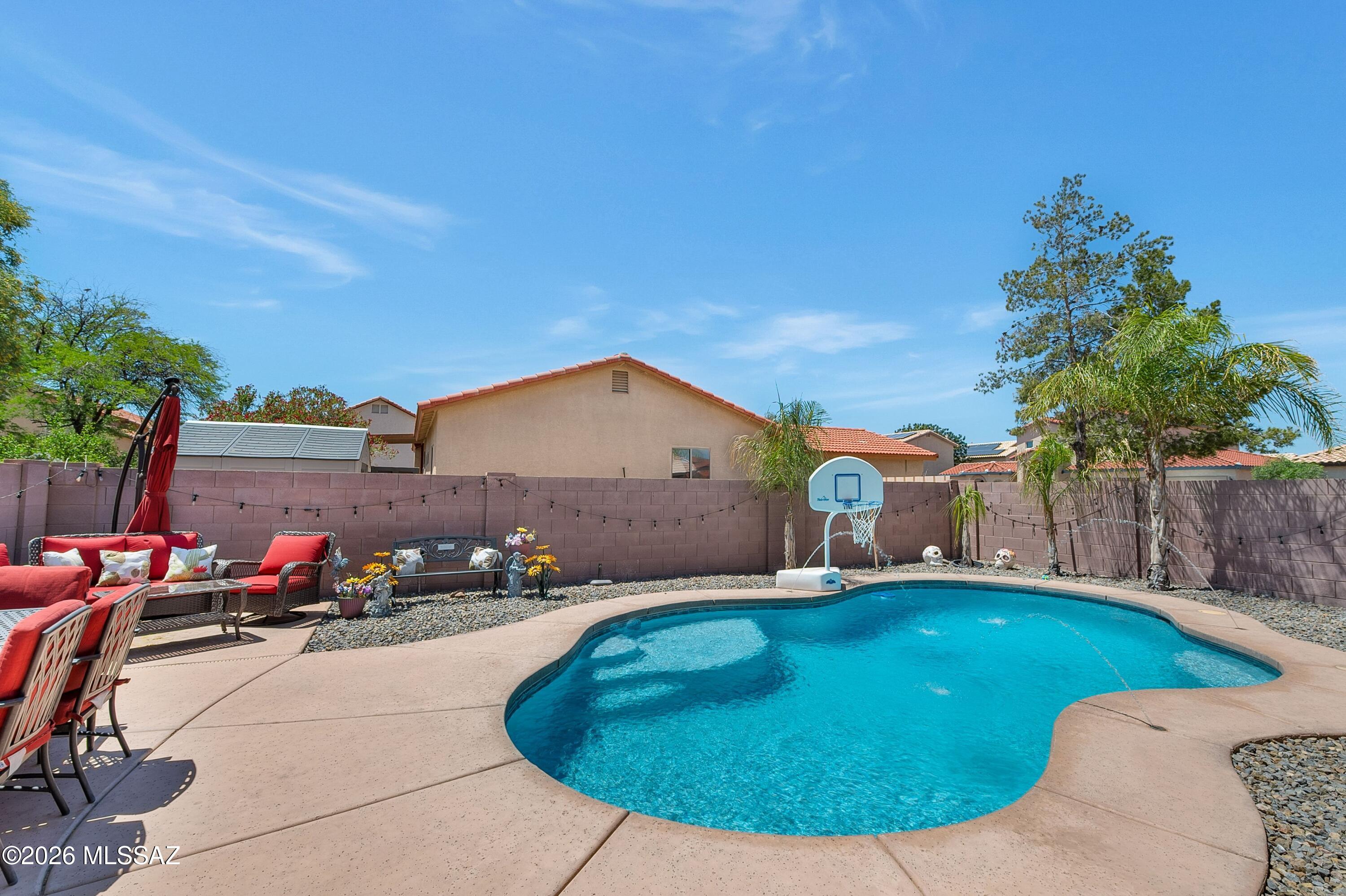 7159 West Maple Ridge Drive Tucson, AZ 85743 - Photo 29 of 42 a view of a backyard with plants and outdoor seating
