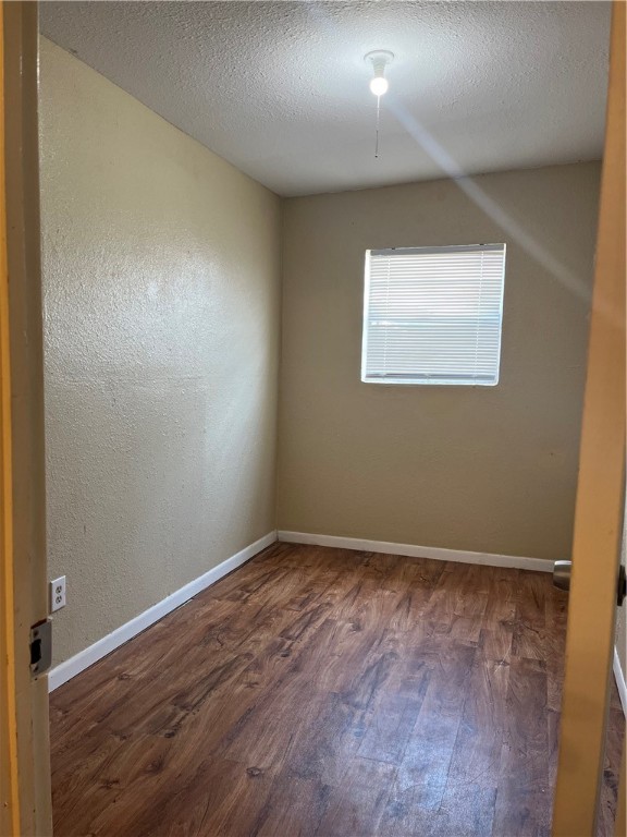 138 Doyle Drive Portland, TX 78374 - Photo 18 of 24 an empty room with wooden floor and windows