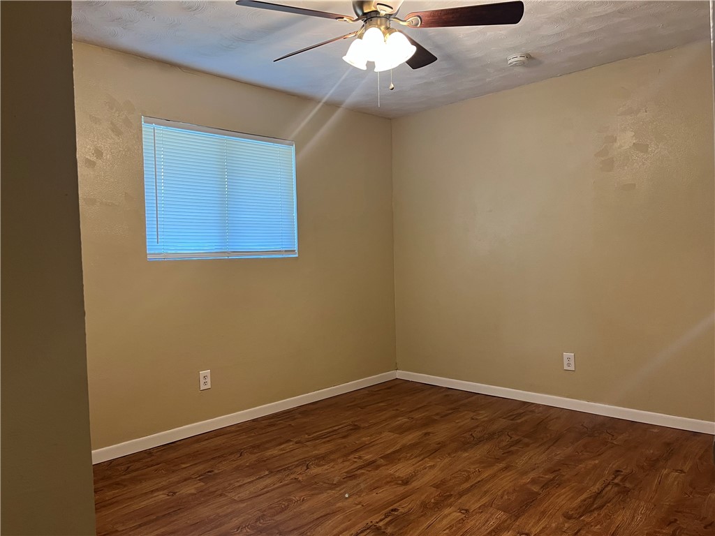 138 Doyle Drive Portland, TX 78374 - Photo 20 of 24 a view of an empty room with wooden floor