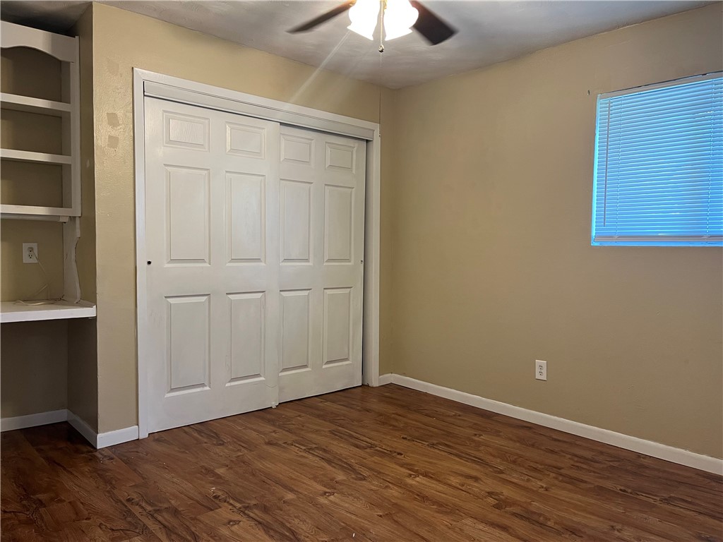 138 Doyle Drive Portland, TX 78374 - Photo 21 of 24 a view of an empty room with wooden floor and a window