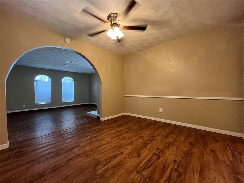 138 Doyle Drive Portland, TX 78374 - Photo 7 of 24 an empty room with wooden floor and windows