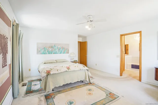 a room with a bed and a window